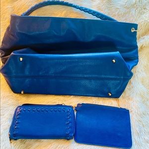 Rich blue purse with small clutch and wallet.
